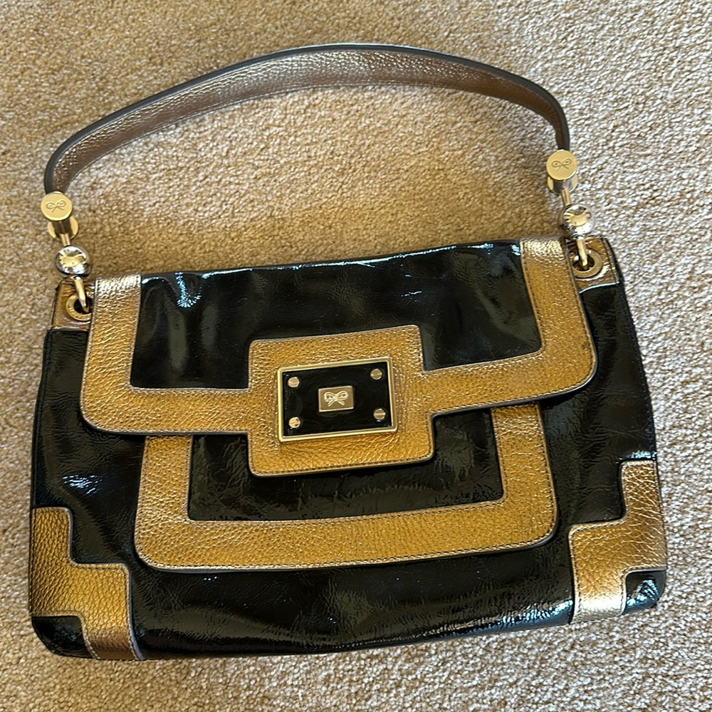 GUC! Anya Hindmarch patent leather bag.